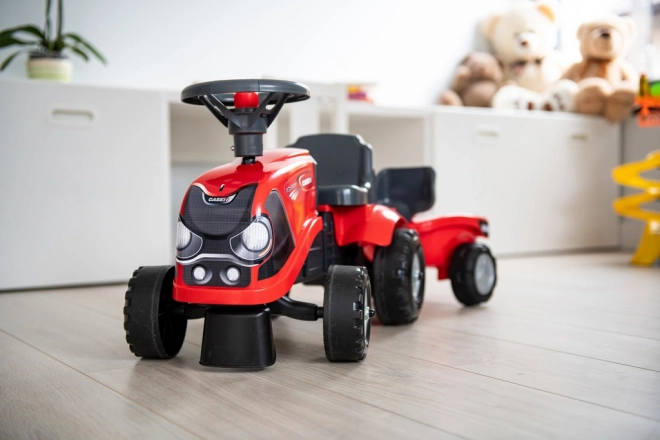 Jeżdżący traktor Baby Case IH czerwony z przyczepą
