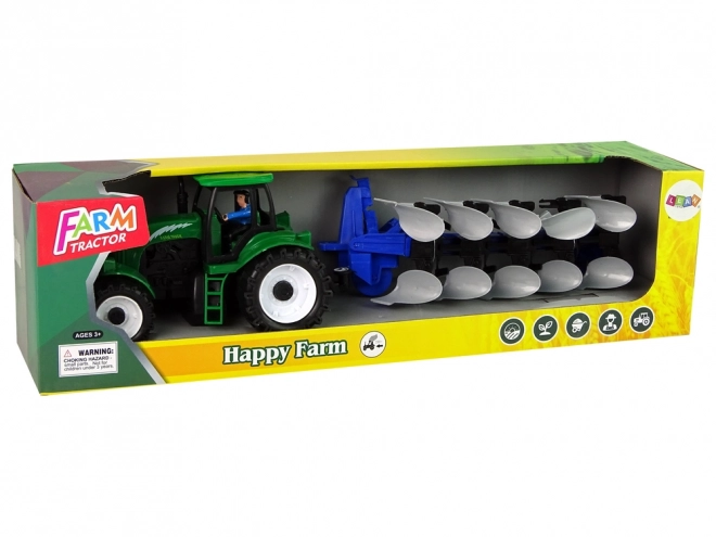 Zielony traktor rolniczy z pługiem