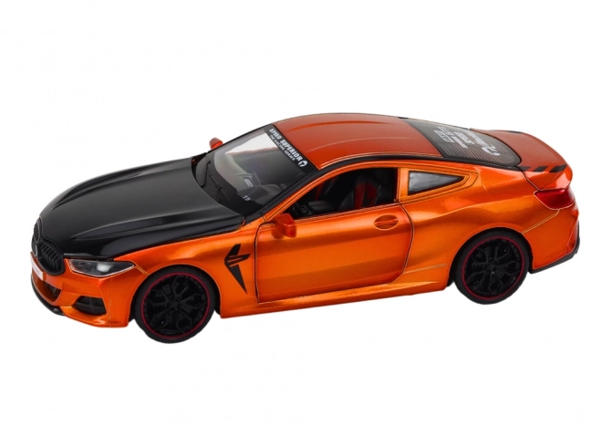 Metalowy model sportowy z napędem ciernym i otwieranymi elementami 1:24 pomarańczowy