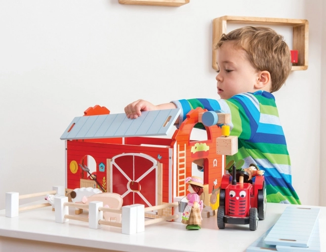 Le Toy Van czerwony traktor i przyczepa