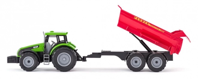 Traktor z przyczepą i bykiem z ogrodem