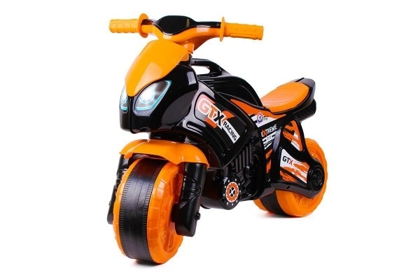 Jeździk motocykl pomarańczowo-czarny plastik w worku 35x53x74 cm 24m+