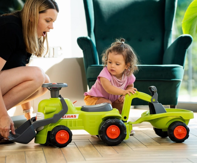 Jeżdżący traktor Claas z przyczepą, ładowaczem i łyżką