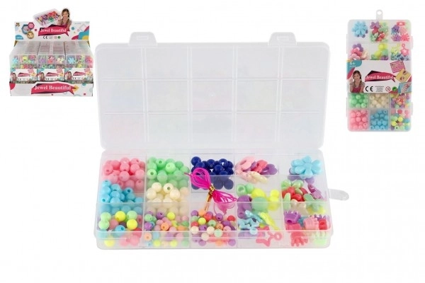 Kolorowe plastikowe koraliki ze sznurkiem w plastikowym pudełku 10x17x2cm