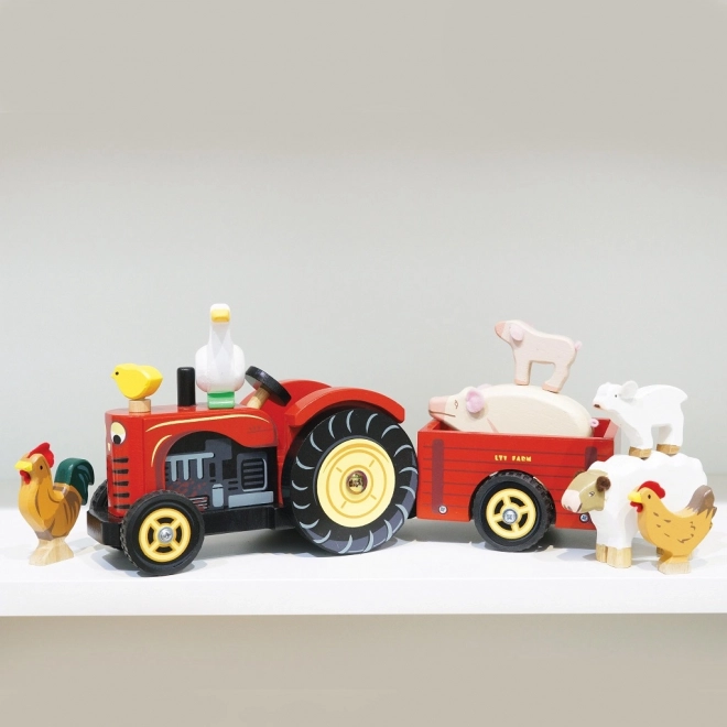 Le Toy Van czerwony traktor i przyczepa