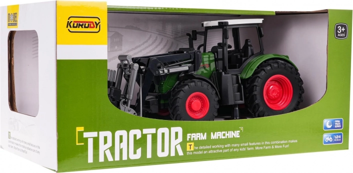 Zielony traktor z chwytakiem