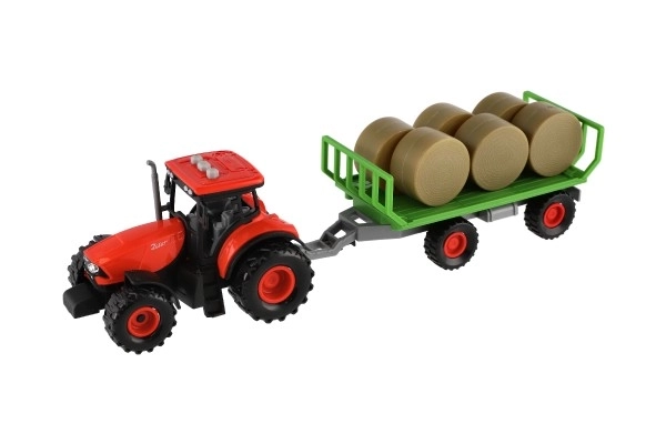 Traktor Zetor z przyczepą i belami plastikowymi 36cm na mechanizm inercyjny na bat. z światłem i dźwiękiem w opak. 39x13