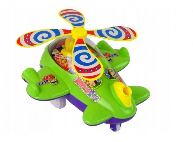 Zielony helikopter pchany z pilotem