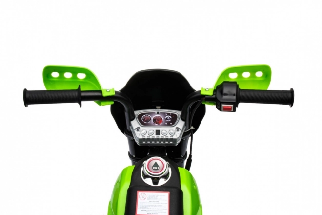 Dziecięcy elektryczny motocykl cross na akumulator – zielony, z kółkami pomocniczymi i światłami LED