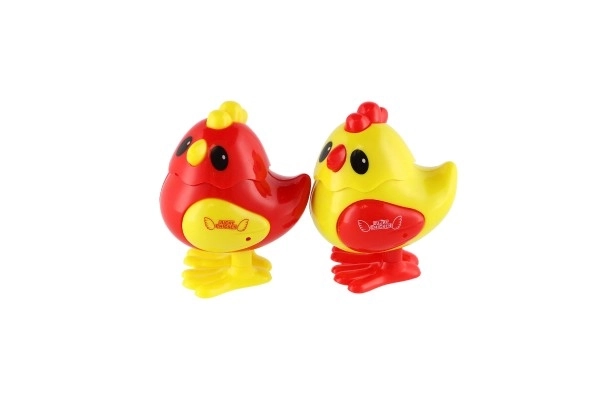 Kurczątko do nakręcania plastik 7x9cm 2 kolory 12szt w pudełku