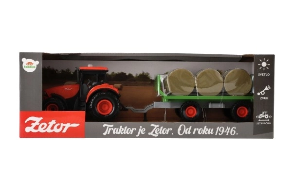 Traktor Zetor z przyczepą i belami plastikowymi 36cm na mechanizm inercyjny na bat. z światłem i dźwiękiem w opak. 39x13