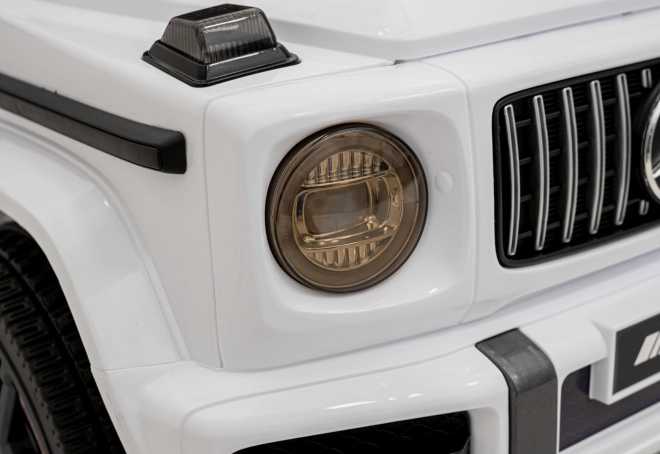 Mercedes AMG G63 dla dzieci biały + zdalne sterowanie + MP3 LED + wolny start + EVA + pasy