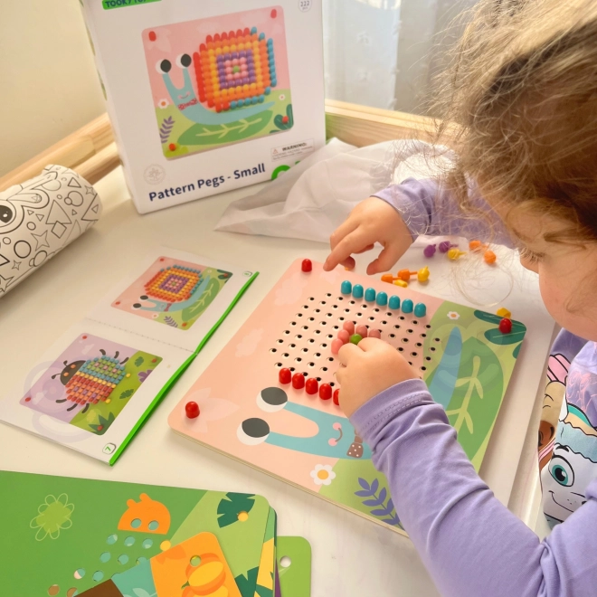 Drewniana układanka z kołeczkami od Tooky Toy