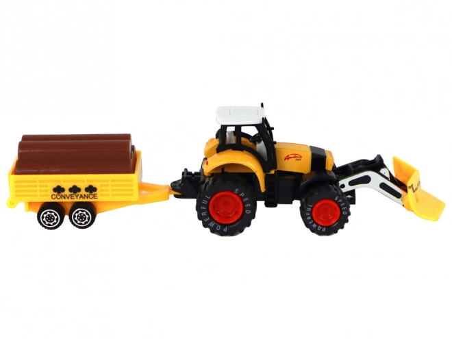 Traktor z przyczepą żółto-czerwony