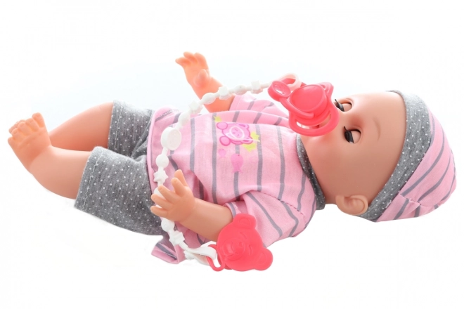 Laleczka sikająca 28 cm z dźwiękiem i akcesoriami