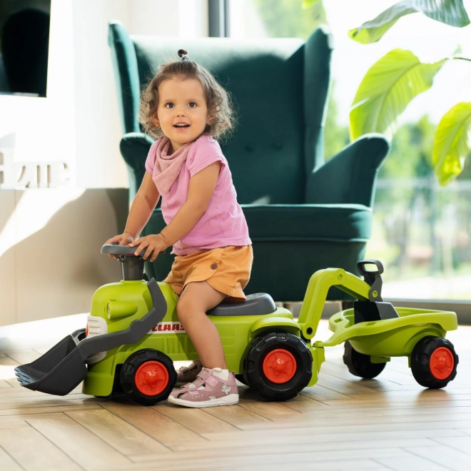Jeżdżący traktor Claas z przyczepą, ładowaczem i łyżką