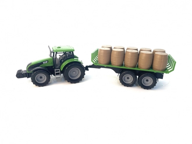 Traktor z mechanizmem bezwładnościowym i przyczepą pełną siana