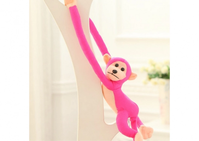 Puchaty maskot małpy z dźwiękiem ciemnoróżowy 60 cm