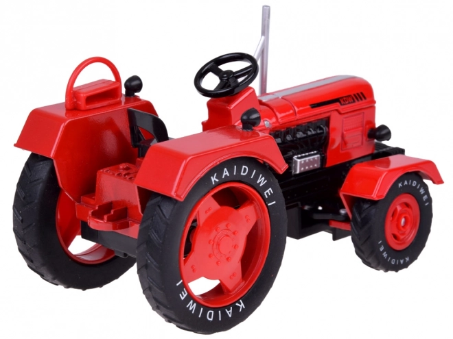 Czerwony metalowy traktor z gumowymi kółkami 1:18