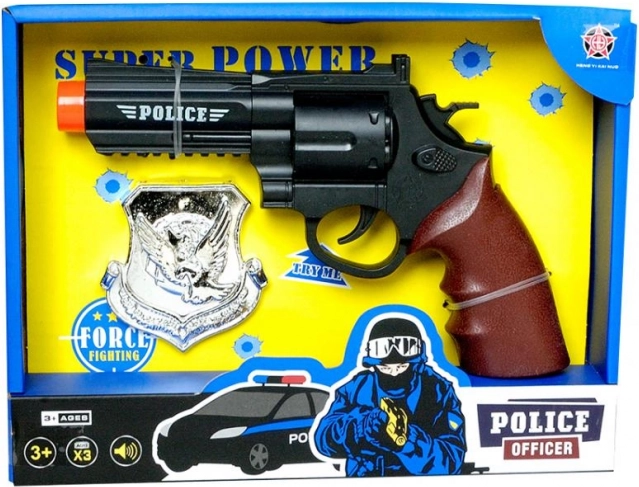 Policyjny pistolet z odznaką PLEJO