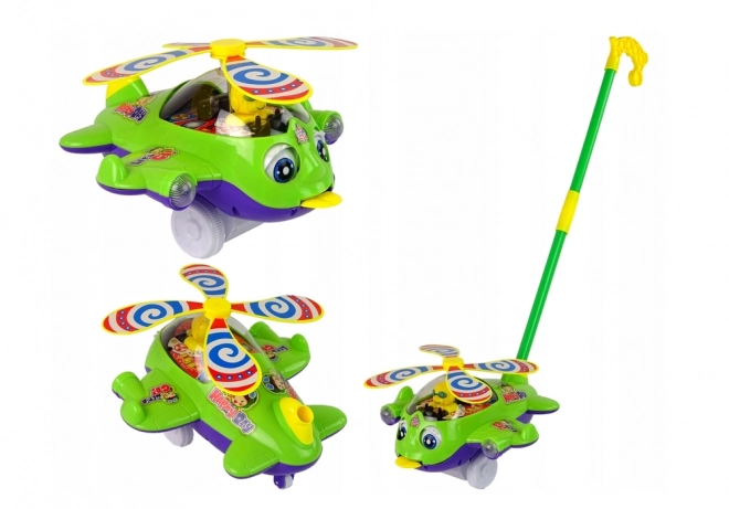 Zielony helikopter pchany z pilotem