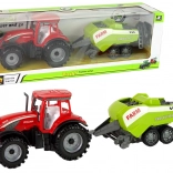 Czerwony traktor z zielonym siewnikiem z napędem ciernym