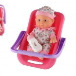 Laleczka niemowlę w nosidełku z butelką 22 cm
