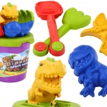 Zestaw do piasku z foremkami dinozaurów – wiaderko, łopatka i grabki