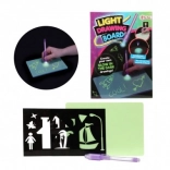 Tabliczka z długopisem z niewidzialnym atramentem świecącym w ciemności